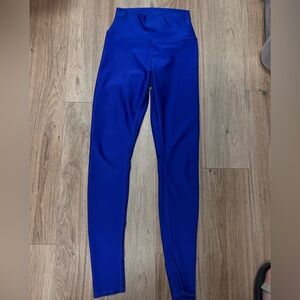 ALO yoga cobalt blue woman’s legging - somewhat shiny material.